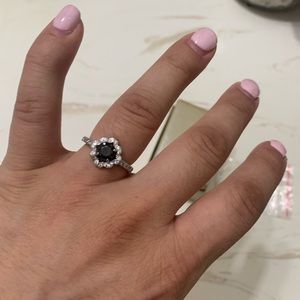 Black onyx and cubic zirconia flower ring in sterling silver.